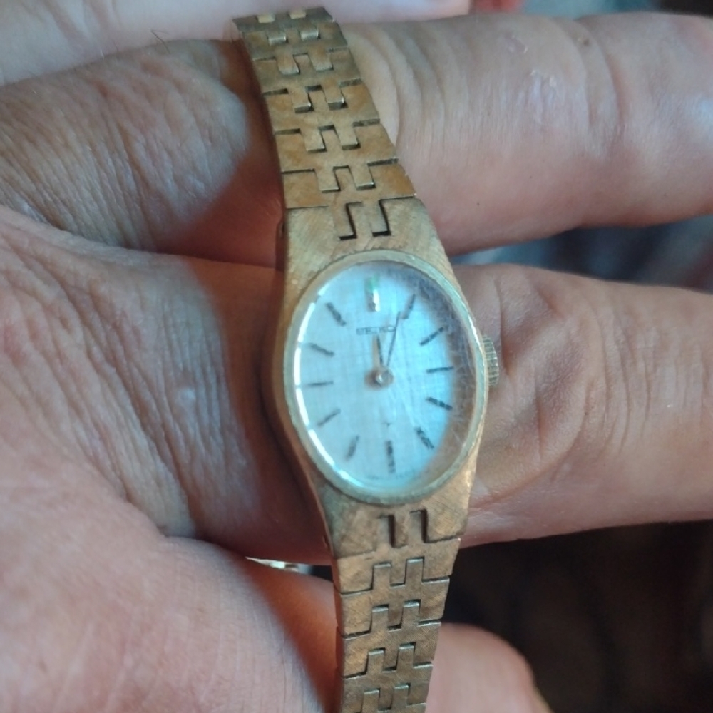 Seiko Gold Wristwatch with White Dial